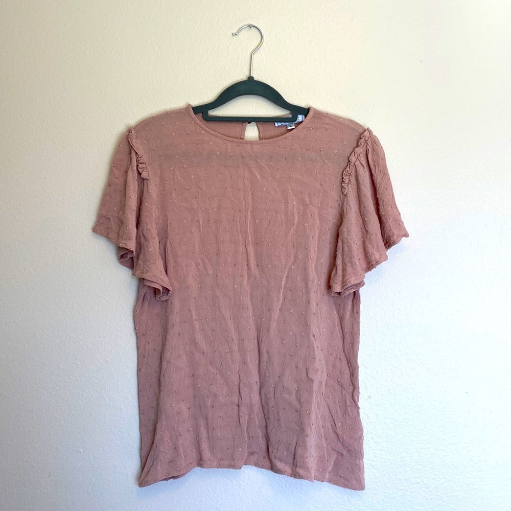 A dip of darling dusty pink Swiss dot short sleeve blouse